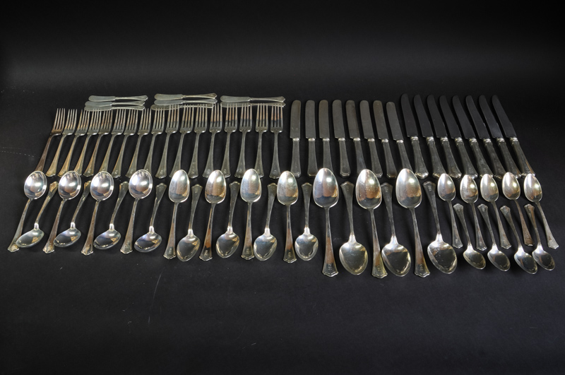 A set of silver cutlery comprising of eight table and dessert forks, eight dessert, tea and soup