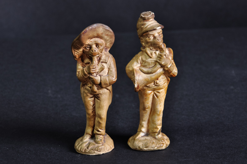 Two figures of monkeys playing wind instruments, possibly pipe tampers (2)