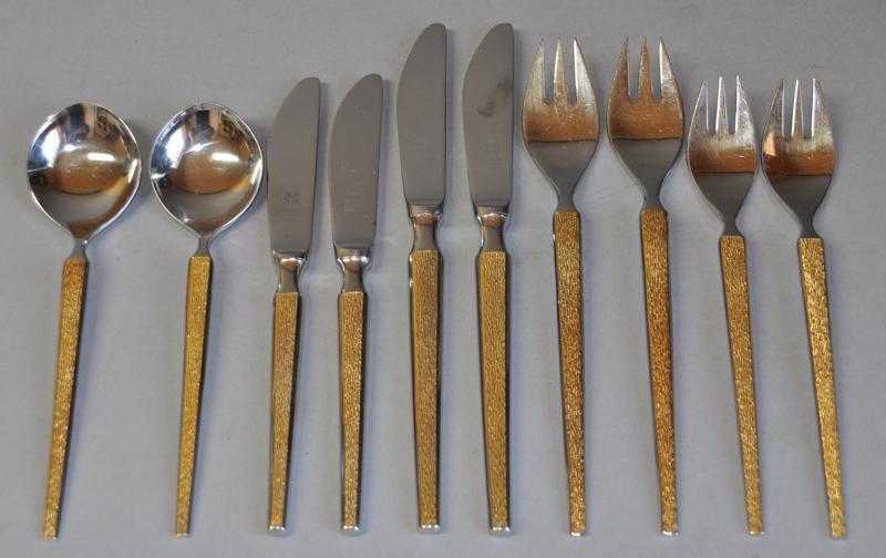 A quantity of German Wirth`s Solingen Rostfrei stainless steel flatware, the handles with yellow