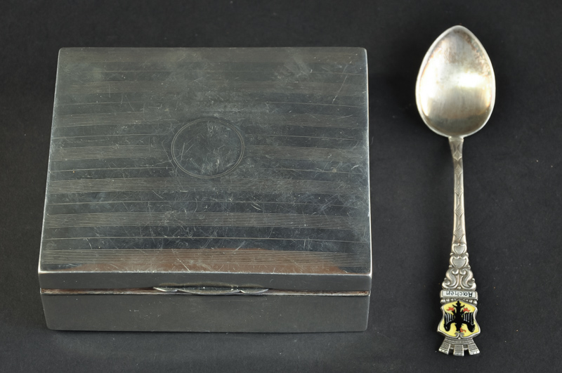 A silver cigarette box, Birmingham, 1921; and a continental silver teaspoon (2)