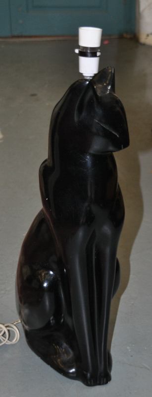 A figural table lamp in the form of a stylised black cat, 59.5cm high approx. excluding fitting