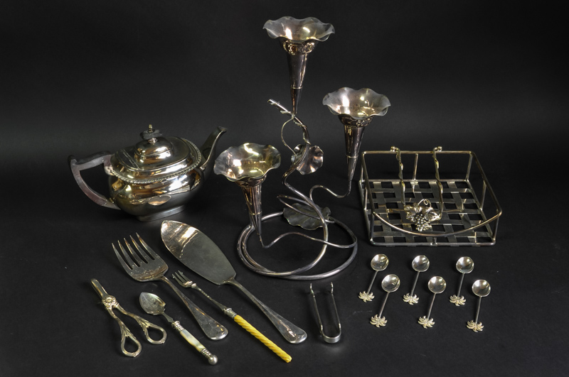 A quantity of silver plate, including an epergne, teapot, napkin holder and various cutlery