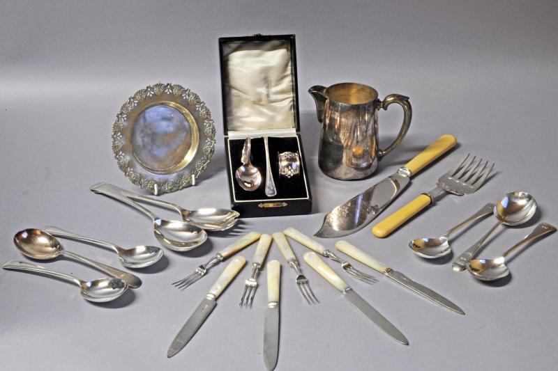 A selection of silver plated items, including a jug, fish servers and cake forks with mother of