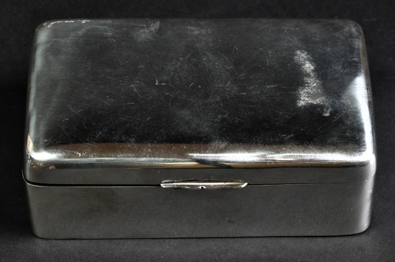 A silver cigarette box, canted rectangular form, monogram to cover, makers mark worn, Birmingham