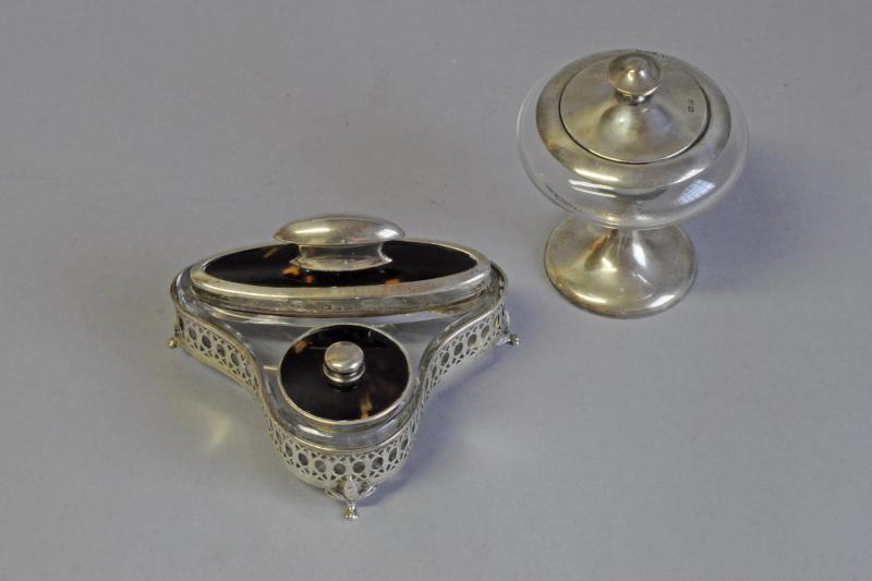 Silver dressing table set; silver and glass pot with a mirrored lid and a silver and glass nail