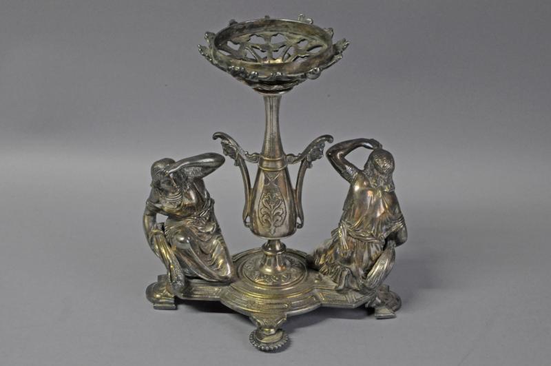 Silver plated stand, figures either side of central column, circa 1890