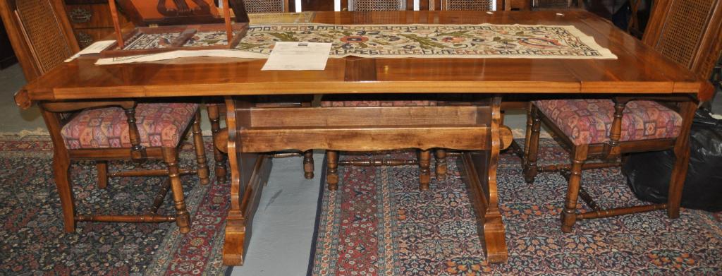 An American walnut dining table with two extra leaves