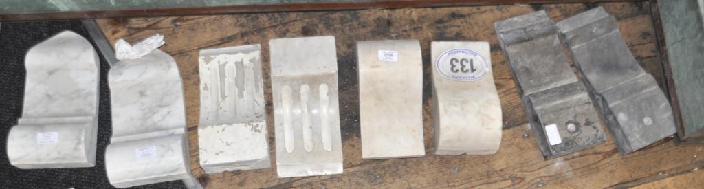 Six pairs of ornamental marble fireplace mounts