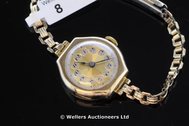 Ladies` 9ct yellow gold cased wristwatch on a rolled gold bracelet