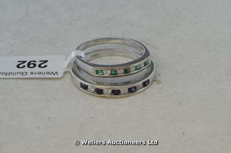 Two half eternity rings, one set with emeralds and diamonds, the other with sapphires and