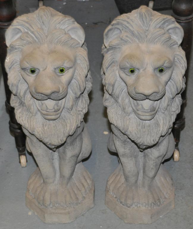 A pair of composition seated lions 54cm