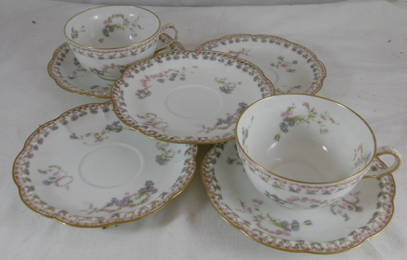 2 Limoges Phillip`s floral tea cups & 5 saucers