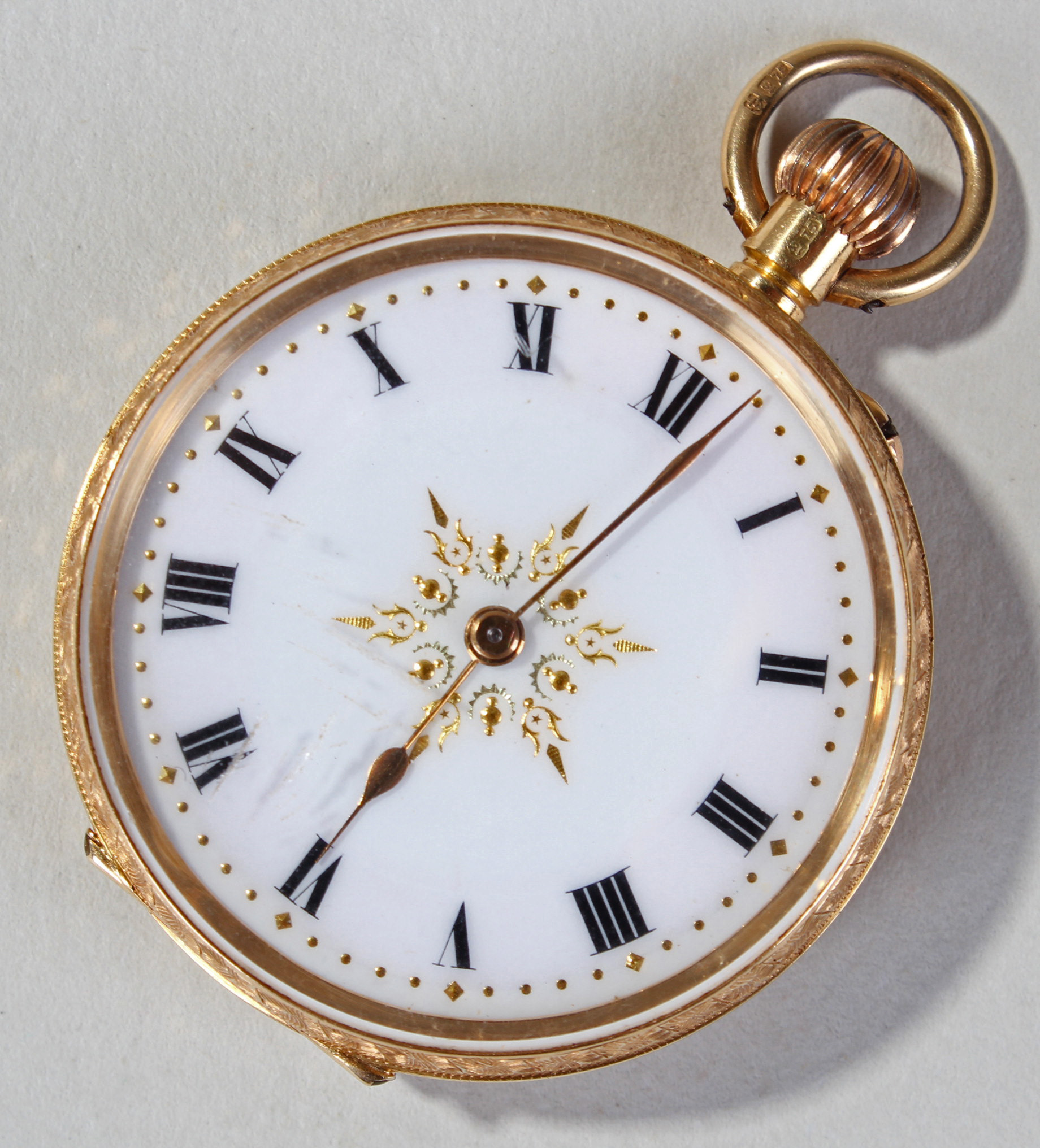 18ct gold ladies fob watch, the white and yellow enamel dial having black roman numerals surrounded