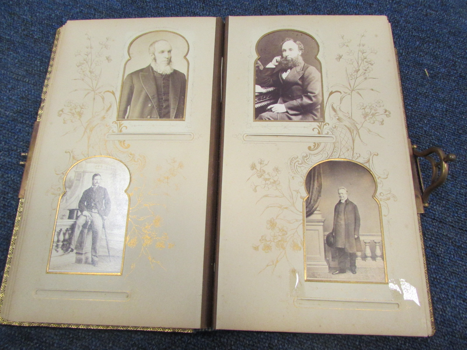 Chiselled Leather Victorian Photo Album measuring approx 10.5 x 6.5 inches with clasp in good