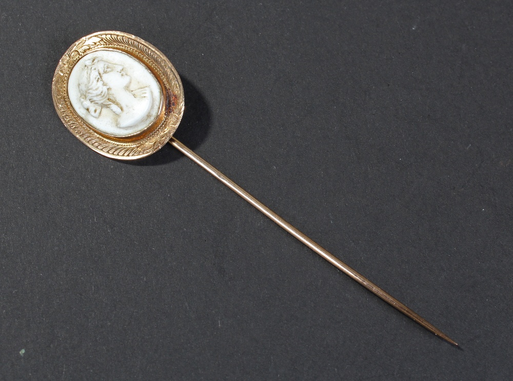 Late Victorian yellow metal cameo stick pin, the oval head set with cameo depicting lady in profile,