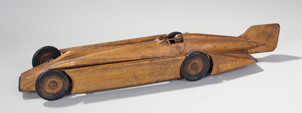 Tin plate model of the land speed car Golden arrow, with driver at the wheel and rubber Dunlop