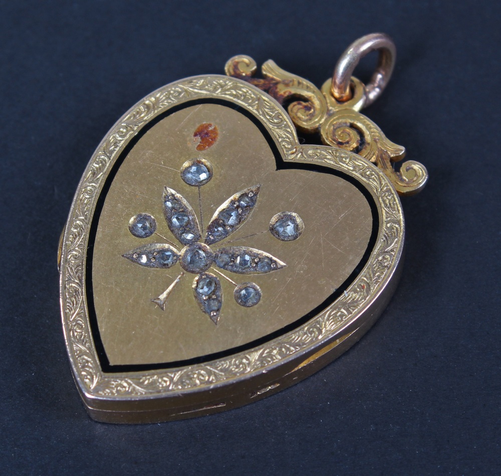 Victorian 15 carat gold diamond set sweetheart locket, the hinged cover with diamond set flower,