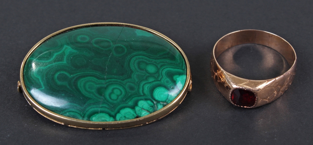 Yellow metal malachite set brooch, of oval form, together with, yellow metal red garnet set ring,