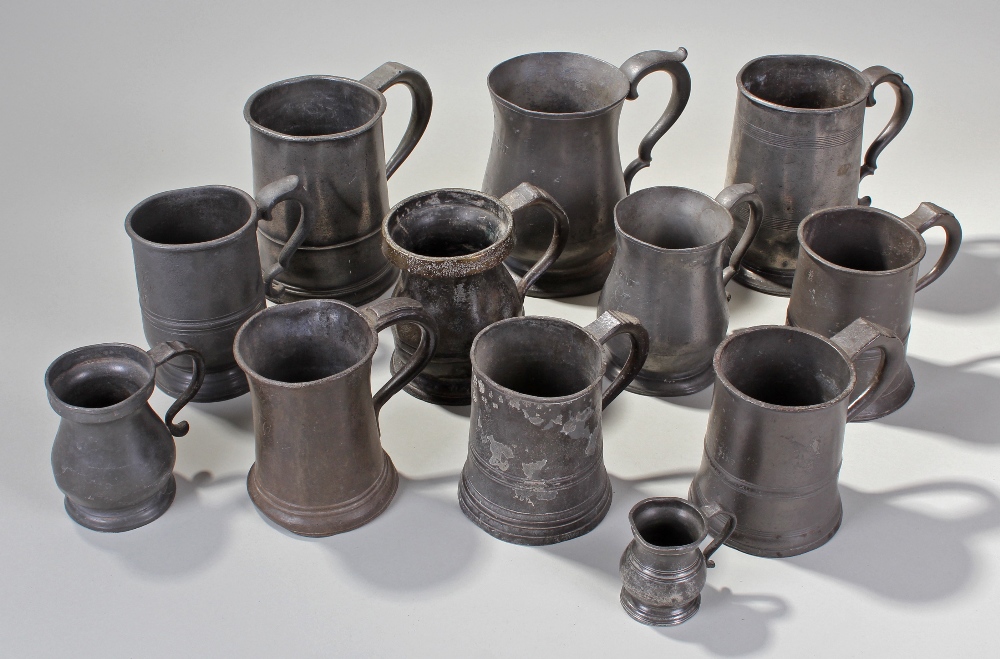 Twelve 19th Century pewter tankards, various sizes from 10cm high to 16cm high