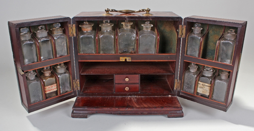 George III mahogany apothecary cabinet, the two hinged doors enclosing compartmentalised interior