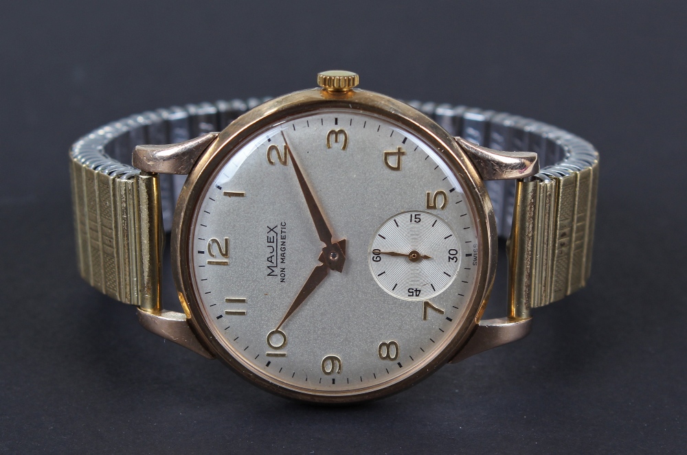 Majex 9 carat gold gentleman`s wristwatch, the silvered dial with gilt arabic numerals, bordered
