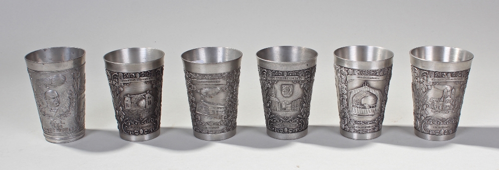 Six souvenir Zeppelin pewter beakers, each with relief moulded scenes depicting Zeppelins and Graf