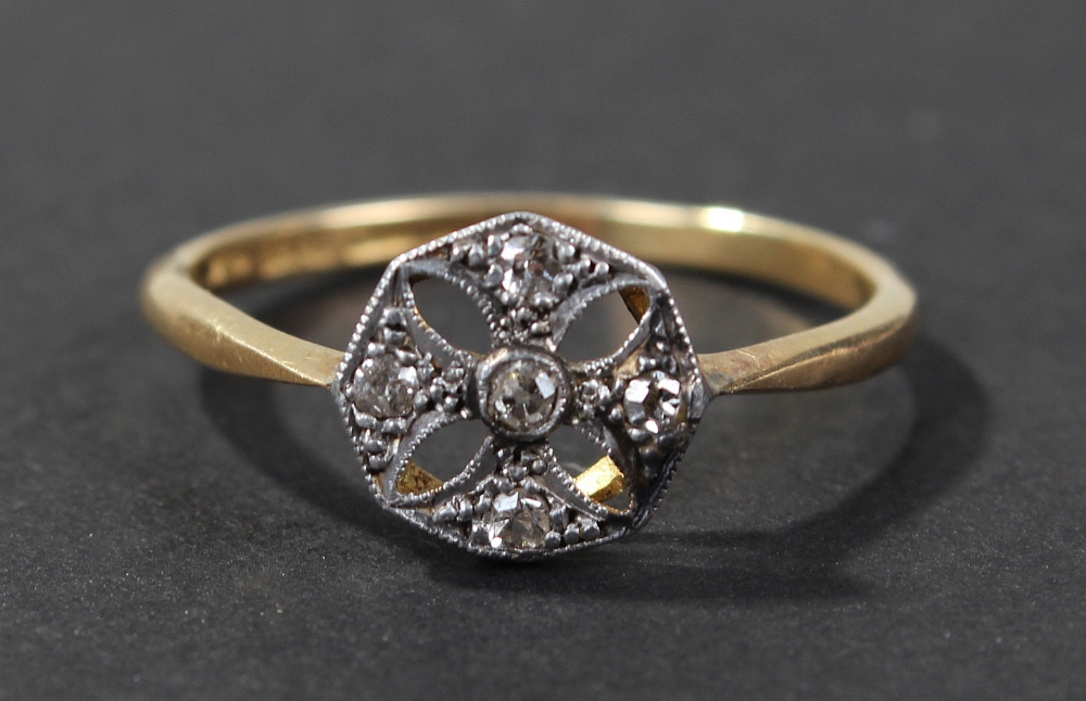 18 carat gold diamond set ring, the pierced platinum head centered with diamond and surrounded by