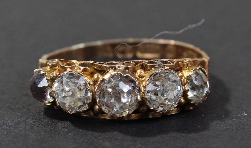 9 carat gold white stone set ring, the band set with a row of five white stones, ring size Q , 1.6