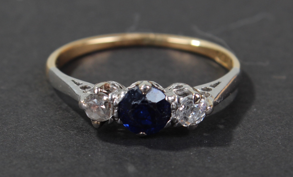 18 carat gold diamond and blue sapphire set ring, set with single brilliant cut blue sapphire