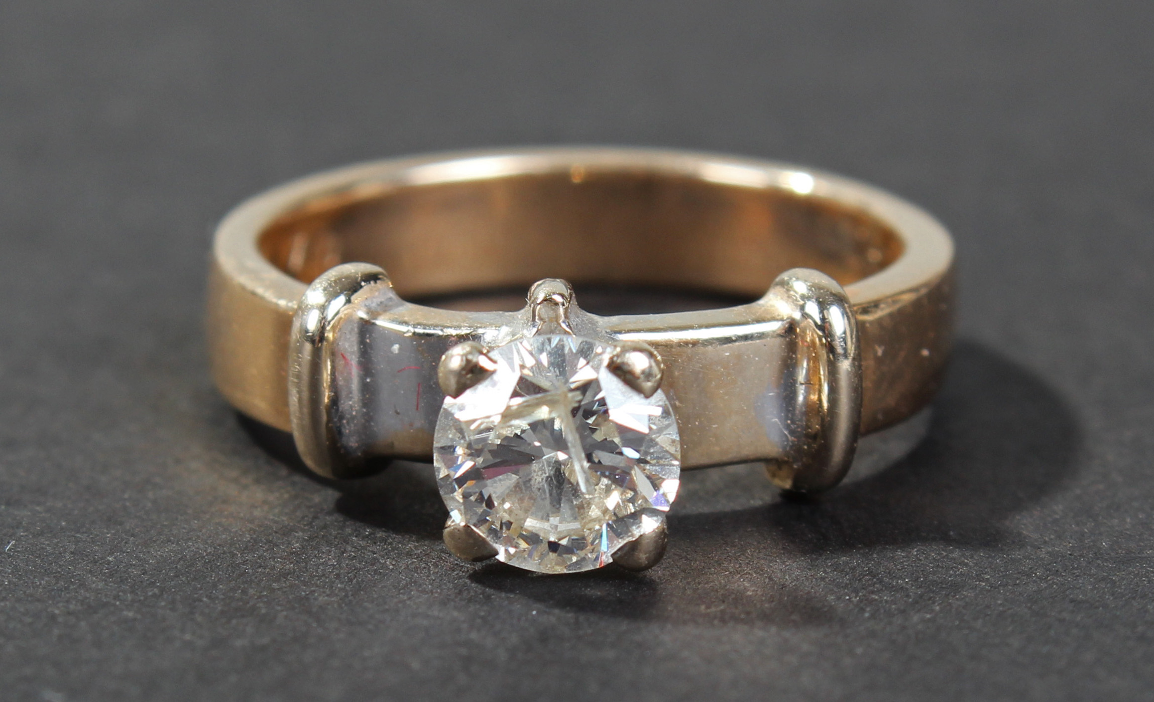 18 carat gold diamond set ring, the band set with a single approx. 1/2 carat brilliant cut