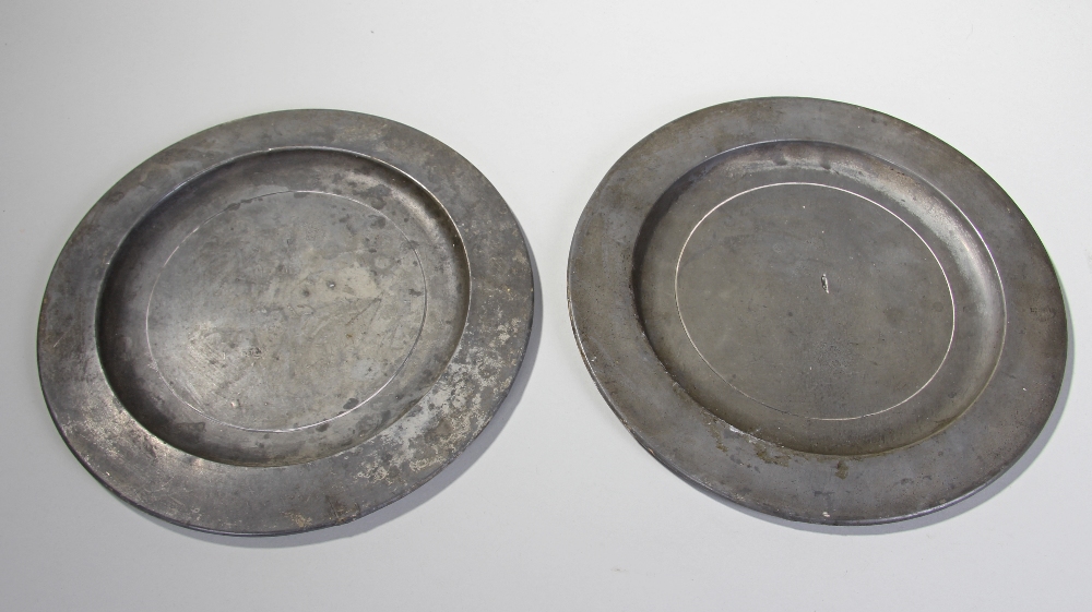 Two 18th Century pewter plates, each with marks to base, 25cm diameter, (2)