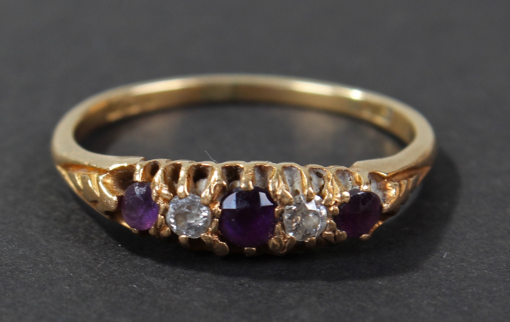 18 carat gold amethyst and diamond set ring, set with a row of three amethyst and two diamonds, ring