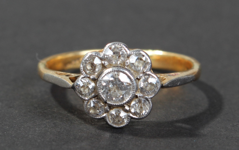 18 carat gold diamond set ring, of flower head form, set with central brilliant cut diamond