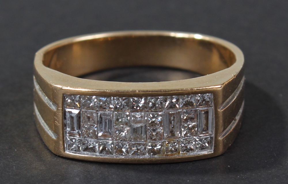 18 carat gold diamond set ring, the band set with five baguette cut and twenty six square cut