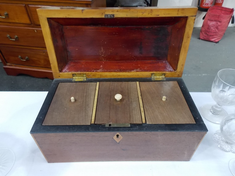 19th Century mahogany boxwood strung tea chest, the hinged lid revealing 3 lidded compartments