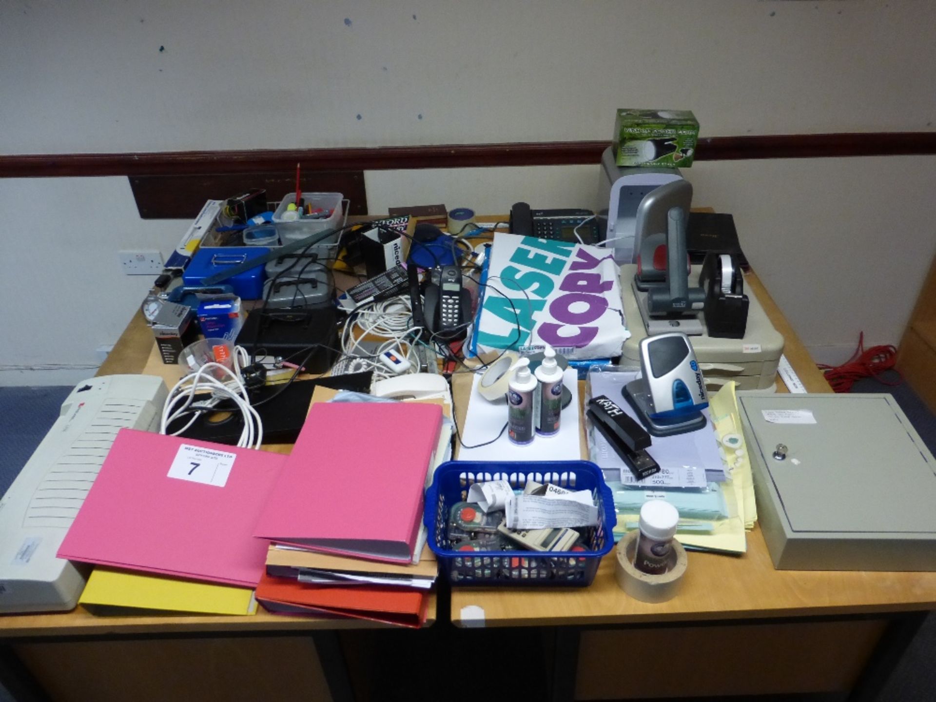 A large qty. of misc. office sundries including; cash boxes, telephones, copy paper, staplers,