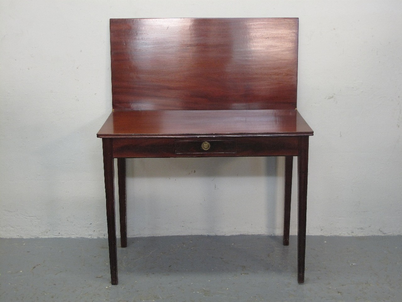 GEORGE III STYLE MAHOGANY RECTANGULAR FOLD OVER TEA TABLE having moulded edge above single cock