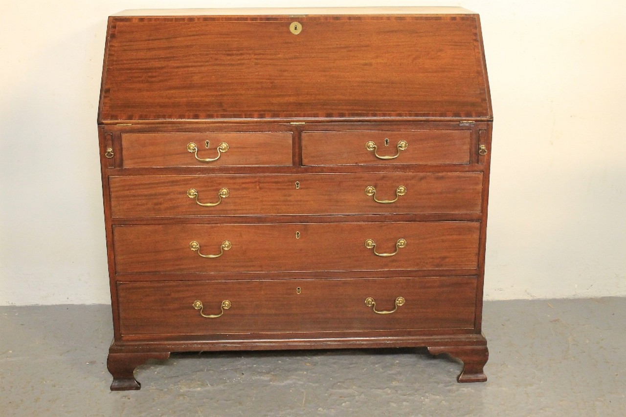 LATE GEORGIAN MAHOGANY FALL FRONT BUREAU, the cross banded fall revealing a satin wood cross banded