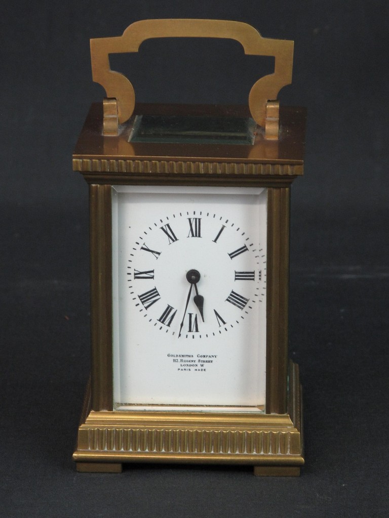 LATE 19TH/EARLY 20TH CENTURY FRENCH BRASS CARRIAGE CLOCK having fluted gorge case with swing handle