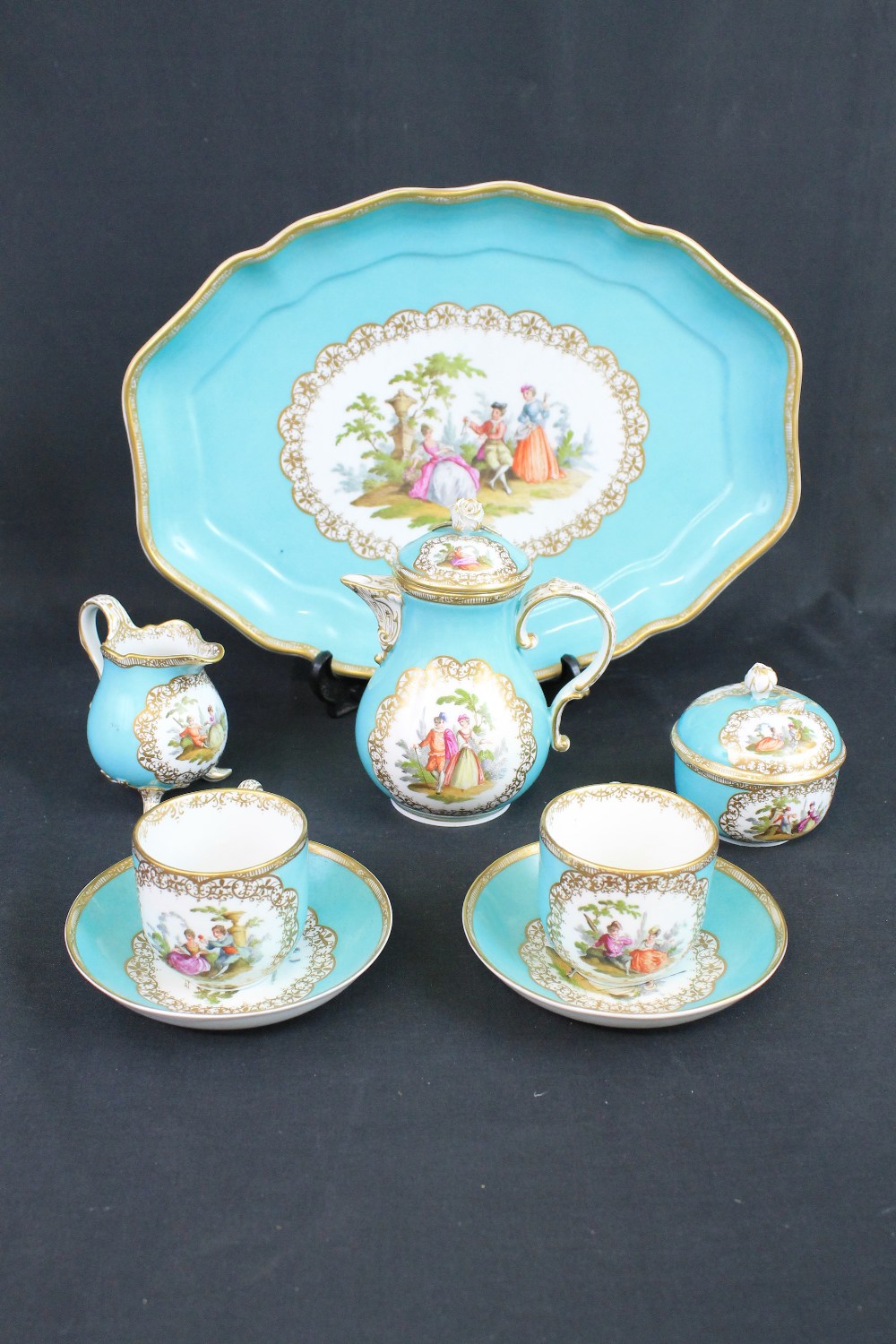 19TH CENTURY MEISSEN PORCELAIN CABARET SET overall decorated with panels of figures in landscapes