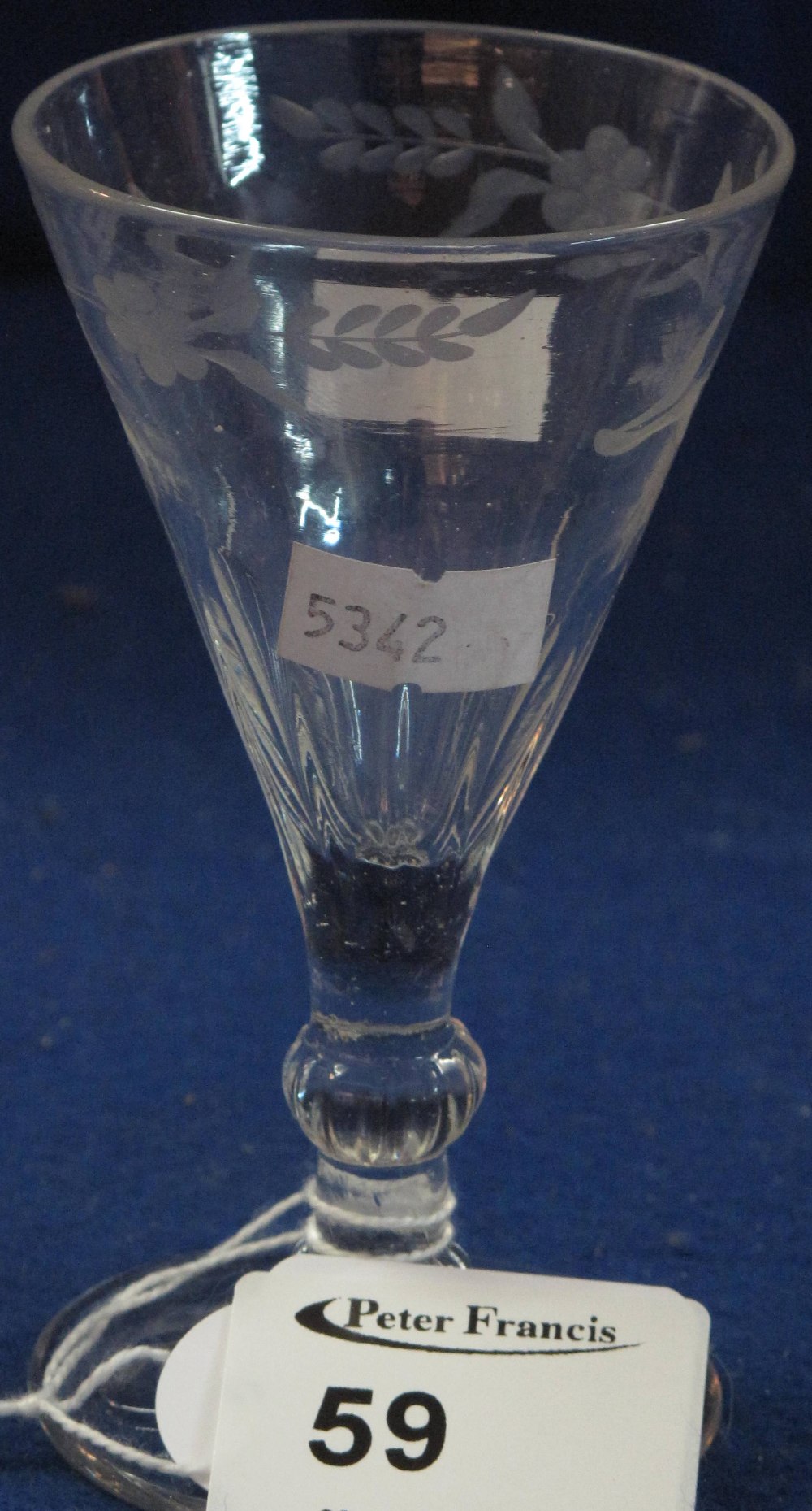 Small 19th Century wheel engraved conical liqueur glass with baluster stem and circular base.