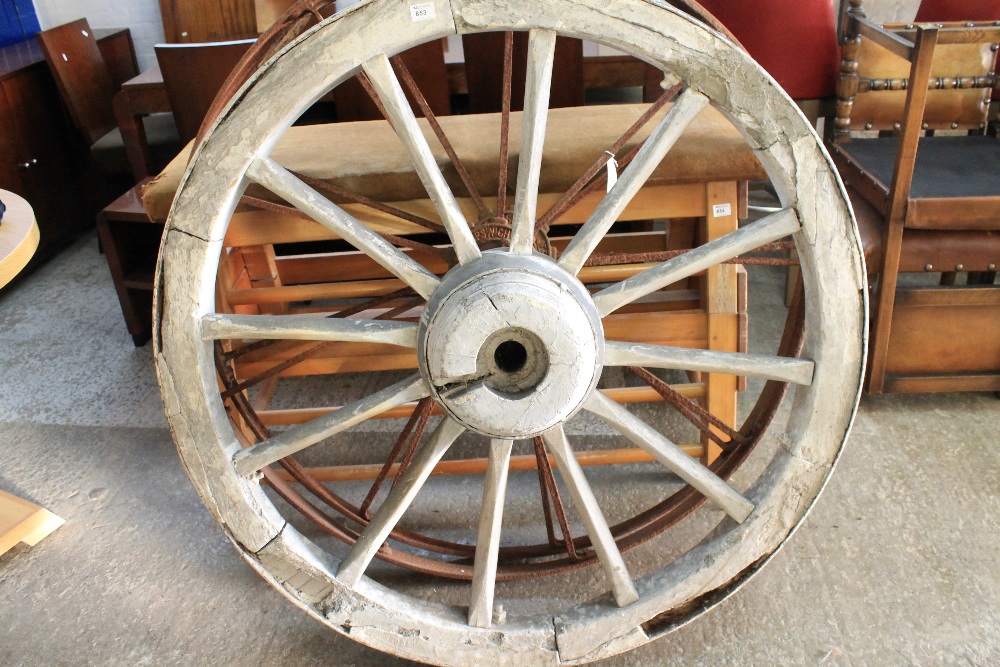 Pair of vintage wooden wagon wheels with metal rims (2)