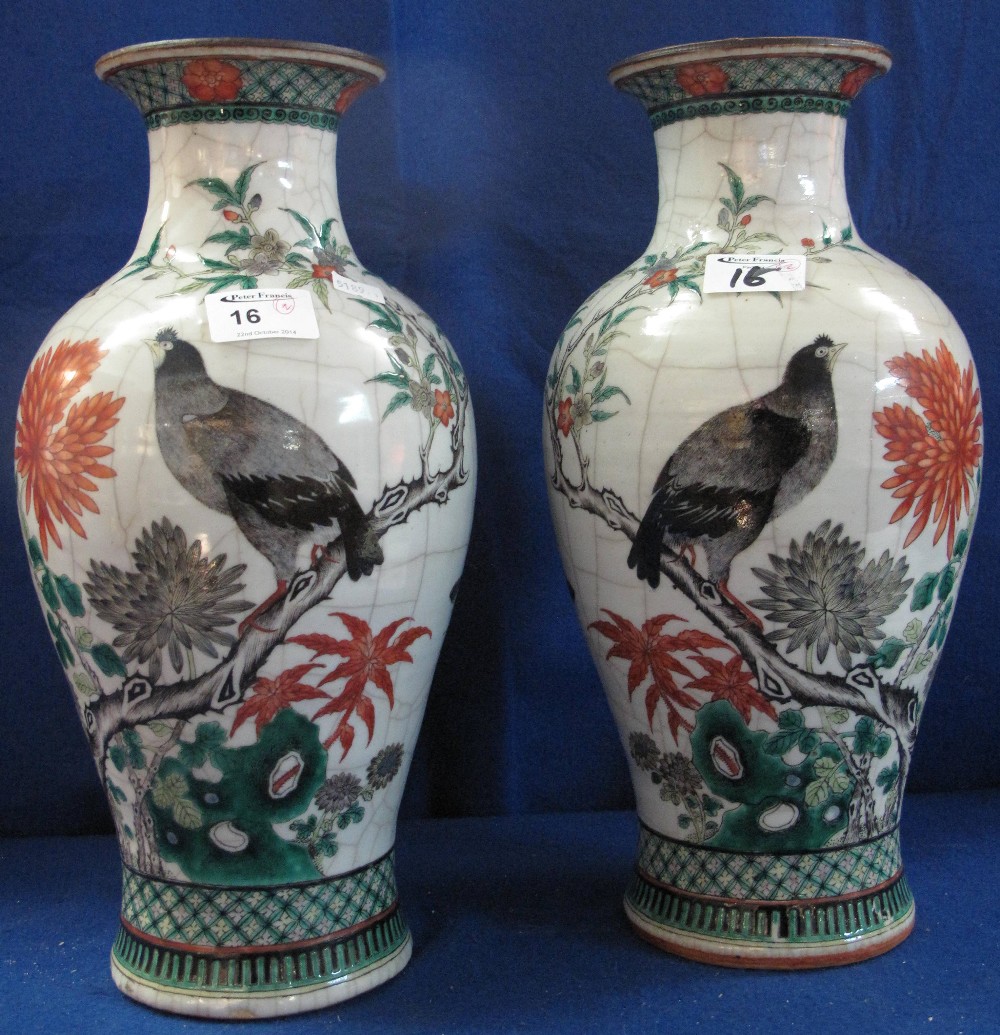 Pair of crackle glazed chinese porcelain baluster shaped vases. Enamel decorated with birds and