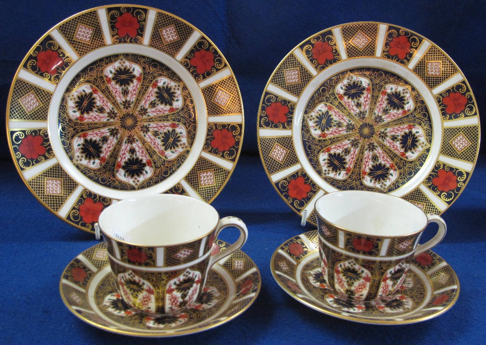 Set of four Royal Crown Derby Imari plates together with two matching cups and saucers. Pattern