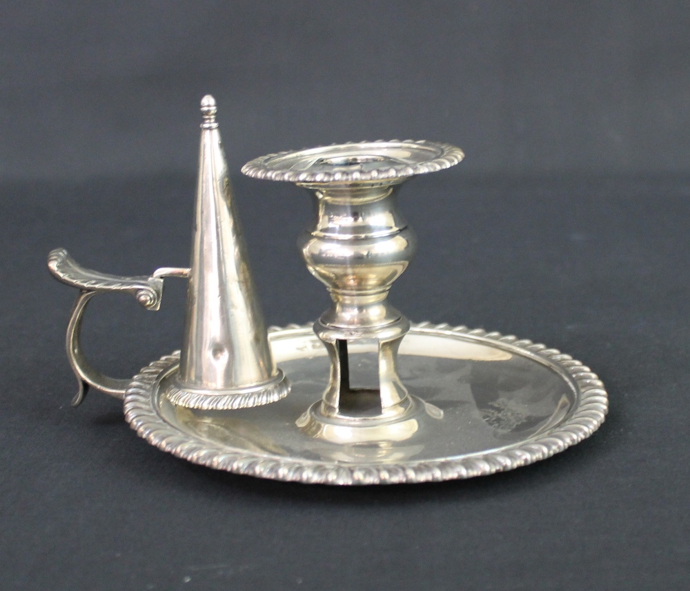 A GEORGIAN SILVER CHAMBERSTICK WITH GADROON EDGES AND FOUR LEAF CAPPED CANDLE  SNUFFER, engraved