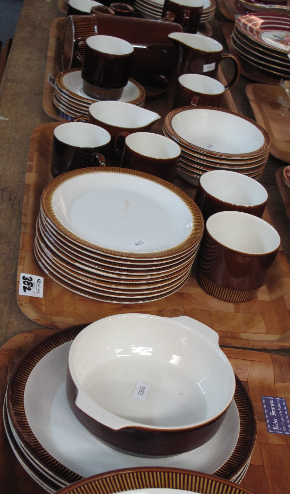 Four trays of brown glazed Poole pottery part coffee and dinner ware items comprising coffee cans