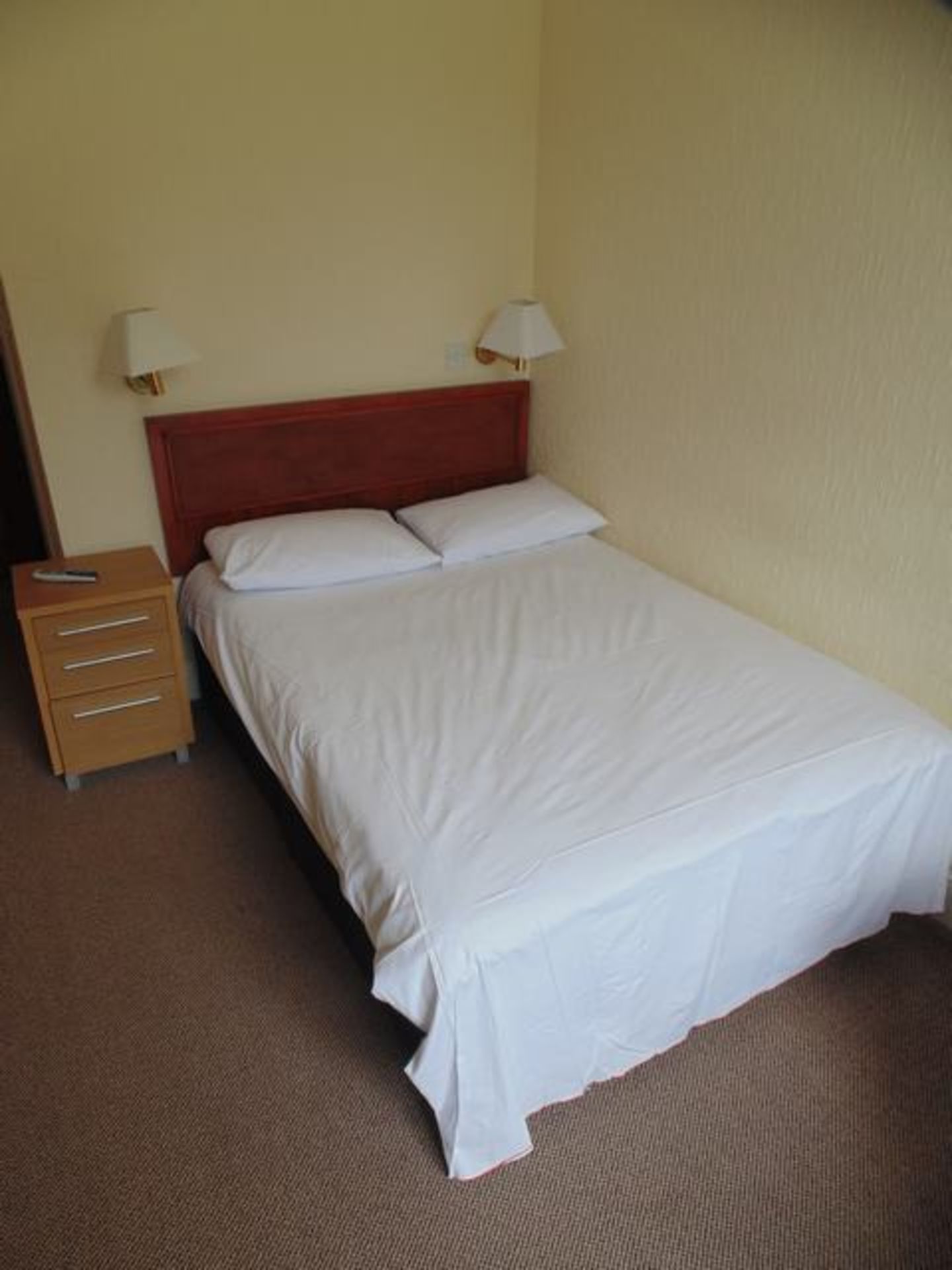Content of Room 20  comprising of double bed and headboard, nightstand, wardrobe, desk and chair,