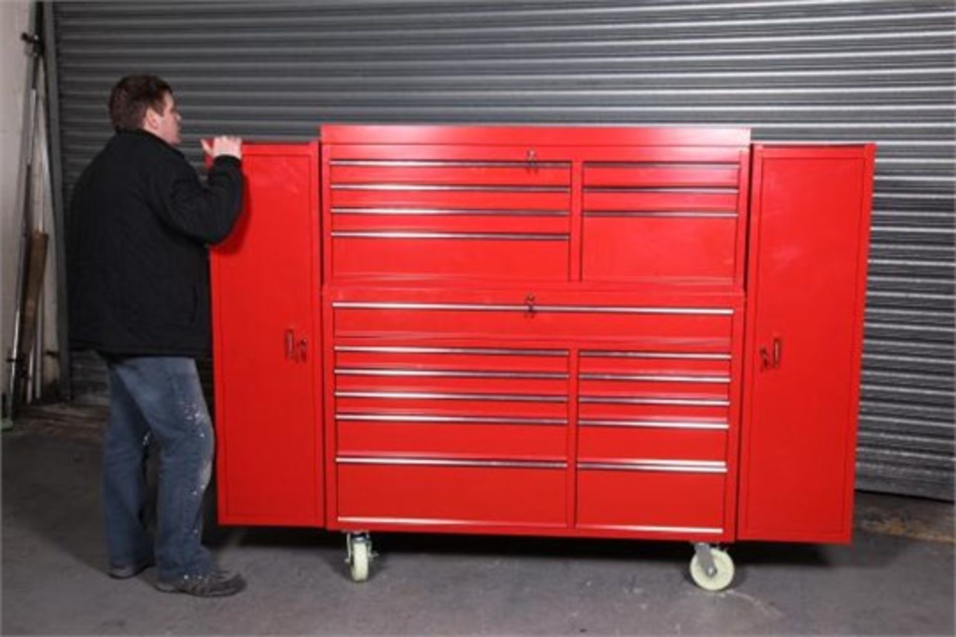 Mild steel powder coated red toolbox has tool chest, handles, side lockers, casters and ball bearing