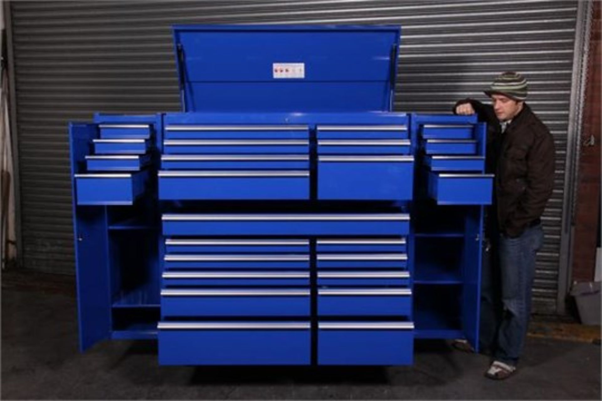 Mild steel powder coated blue toolbox has tool chest, handles, casters and ball bearing sliding