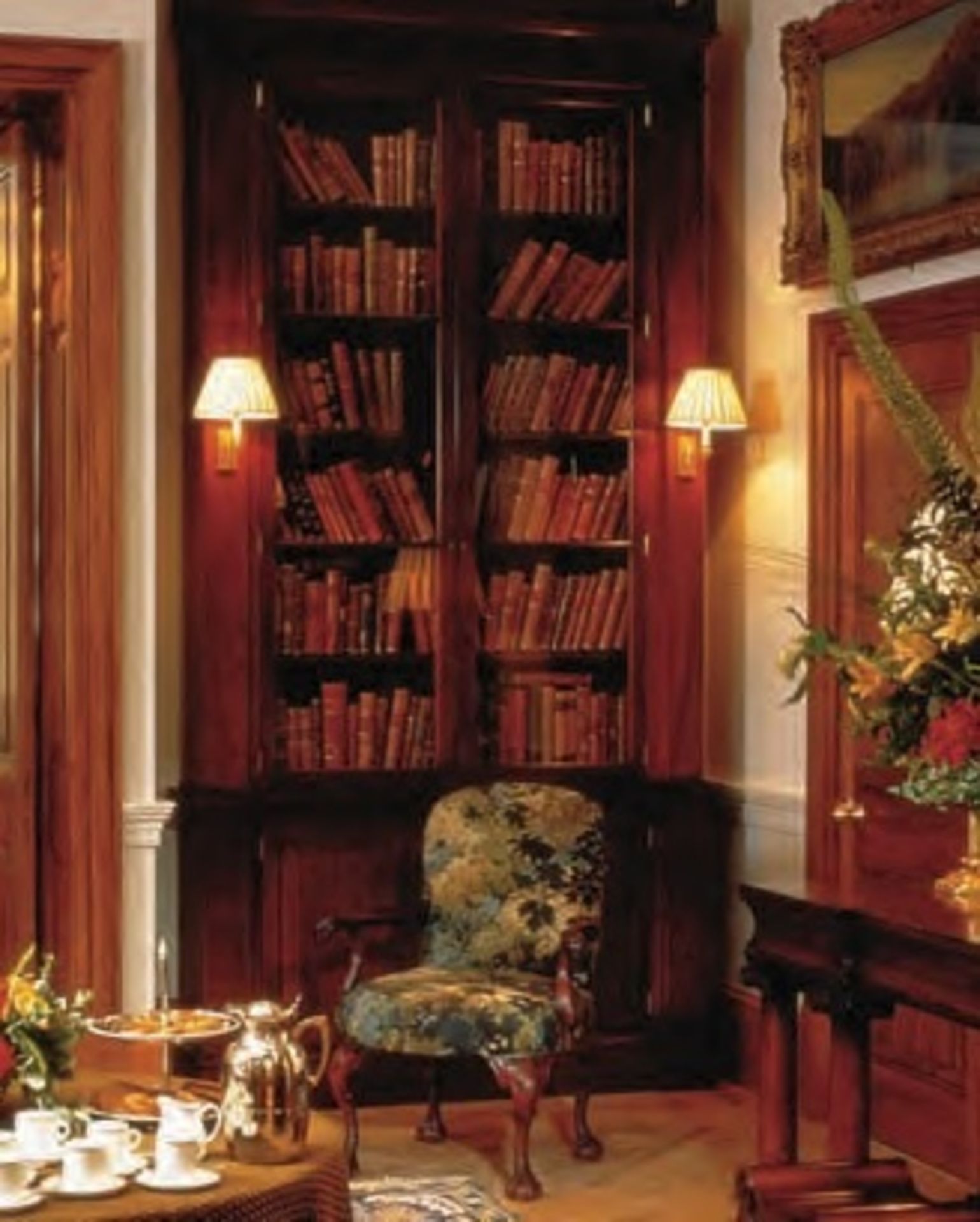 A pair of mahogany library bookcases of full height design, inspired by a rare original
